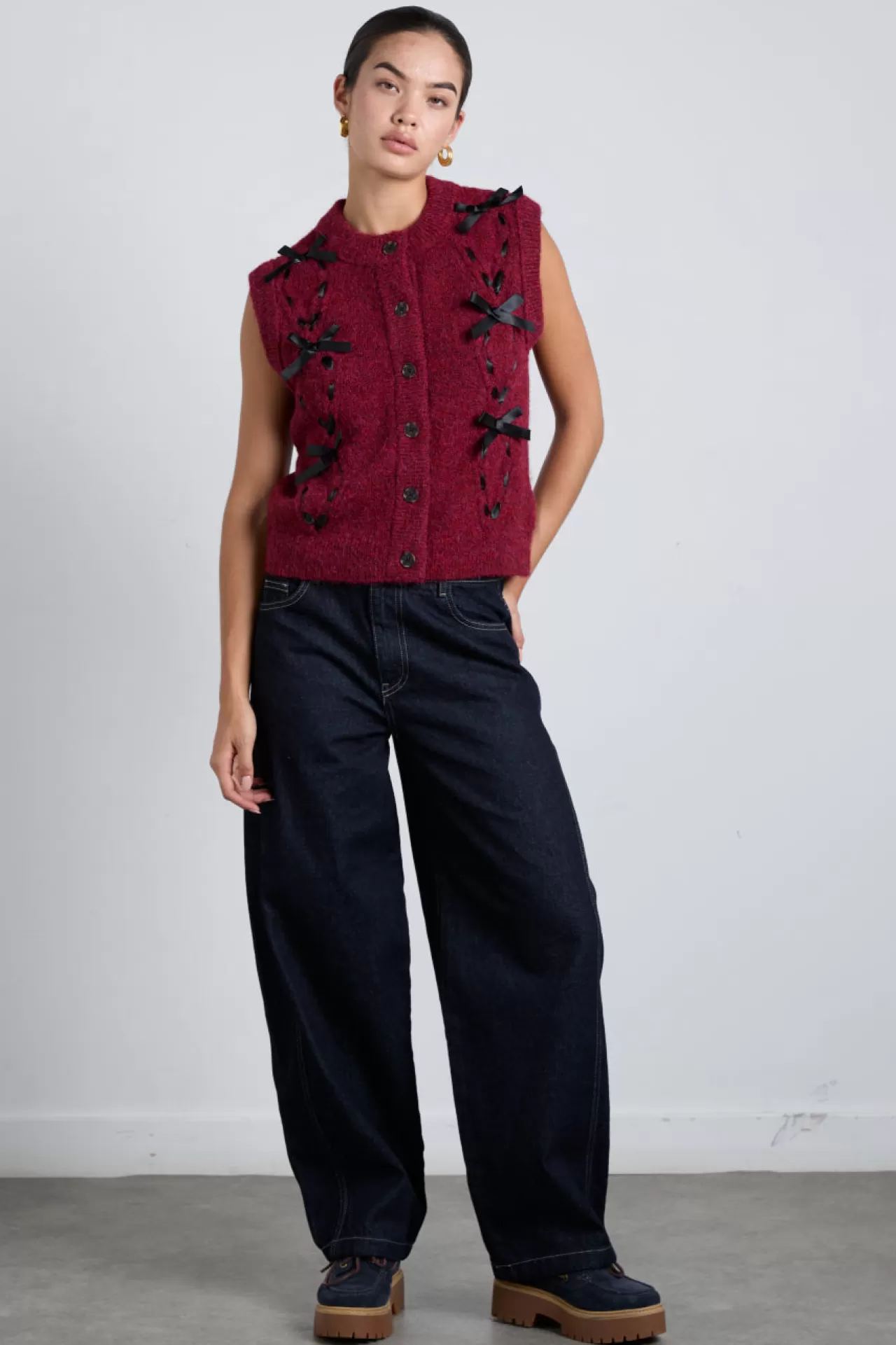 Store Damson Madder aggie knit vest with bows- cable burgundy