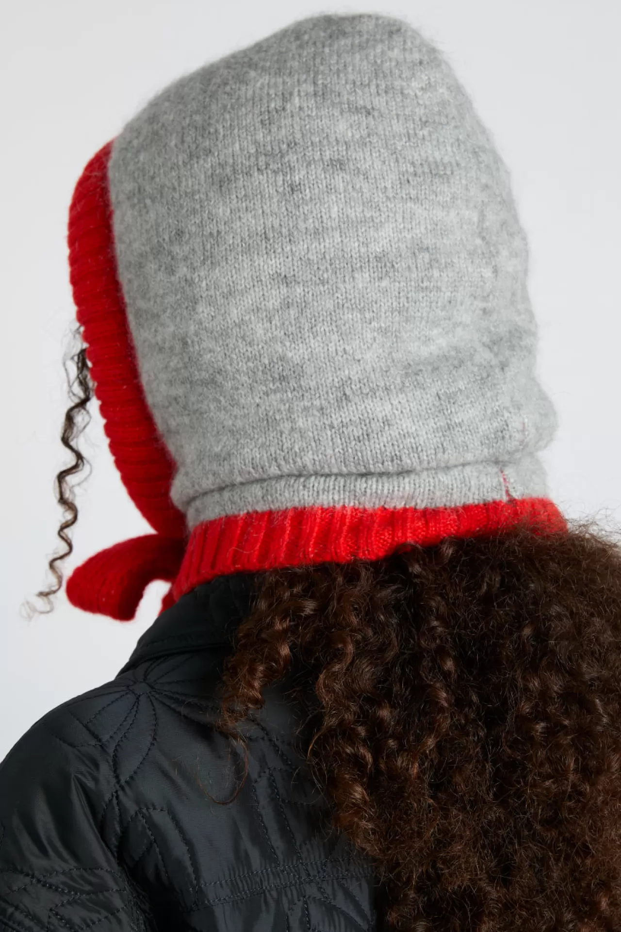 Shop Damson Madder hood in marl with red tie in premium yarn grey