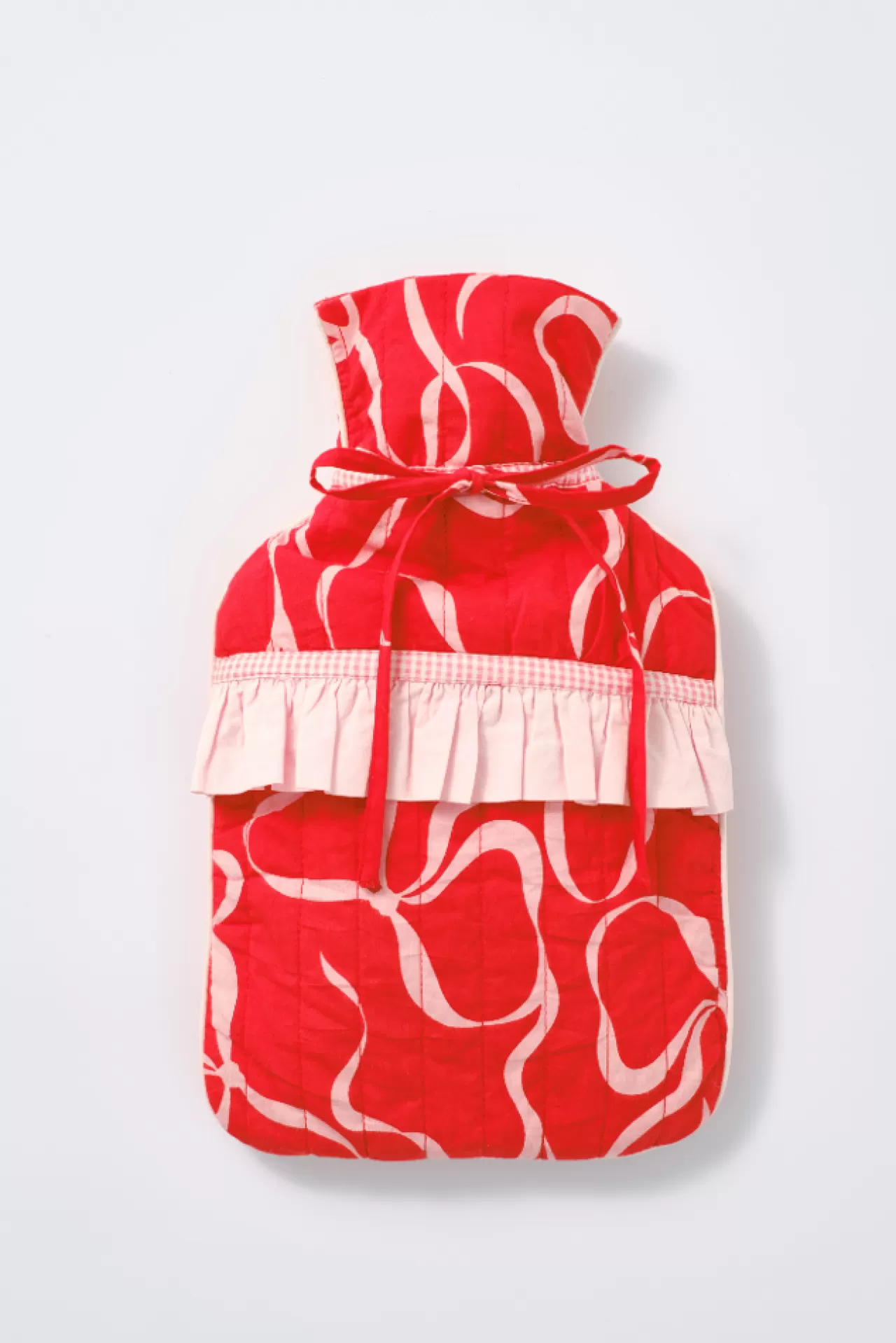 Shop Damson Madder quilted hot water bottle cover - bow print red